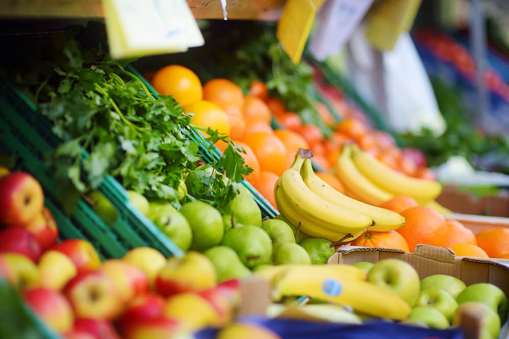 Fresh fruit and vegetables on display at a grocery store